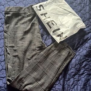 Black plaid pull on pant. Very stylish when paired with the right accessories.